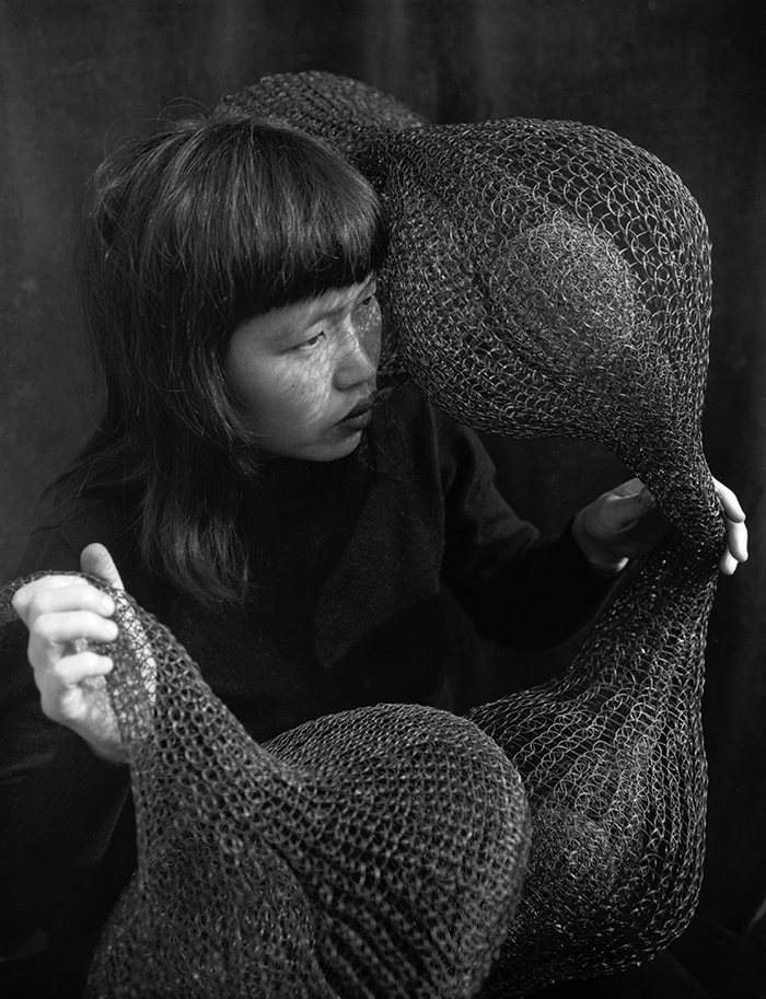 Ruth Asawa Holding a Form-Within-Form Sculpture, 1952 © 2018 Imogen Cunningham Trust Courtesy David Zwirner