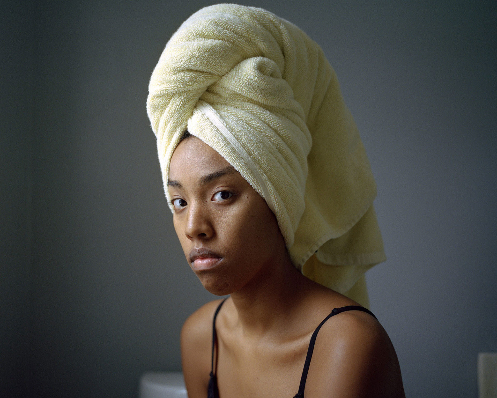 Nadiya Nacorda, Wearing a doek in Lolo and Lola’s bathroom, 2018. Inkjet print. Collection of the artist. © Nadiya Nacorda, from All the Orchids are Fine series.