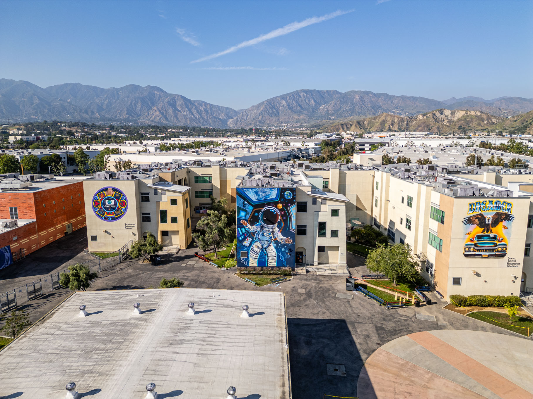 Three of fifteen murals at Cesar Chavez Learning Acadamy, Los Angeles. Photo by Birdman