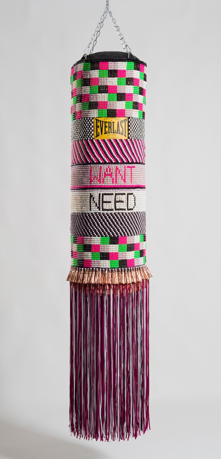 Jeffrey Gibson, Mississippi Band of Choctaw Indians and of Cherokee descentWhat We Want, What We Need, 2014 Found punching bag, glass beads, artificial sinew, copper jingles, nylon fringe, and steel chain 71 in x 14 in x 14 in. Crystal Bridges Museum of American Art, Bentonville, Arkansas, 2015.13.